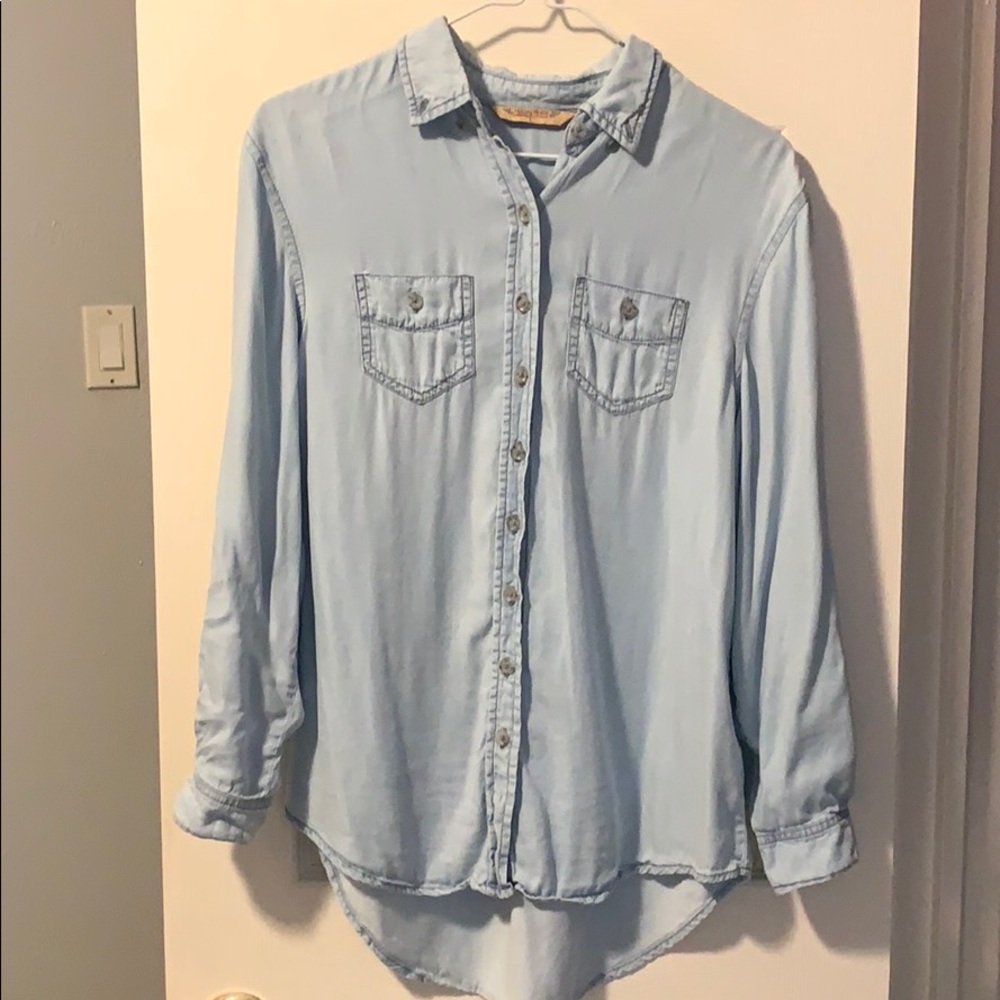 Light blue button up shirt.